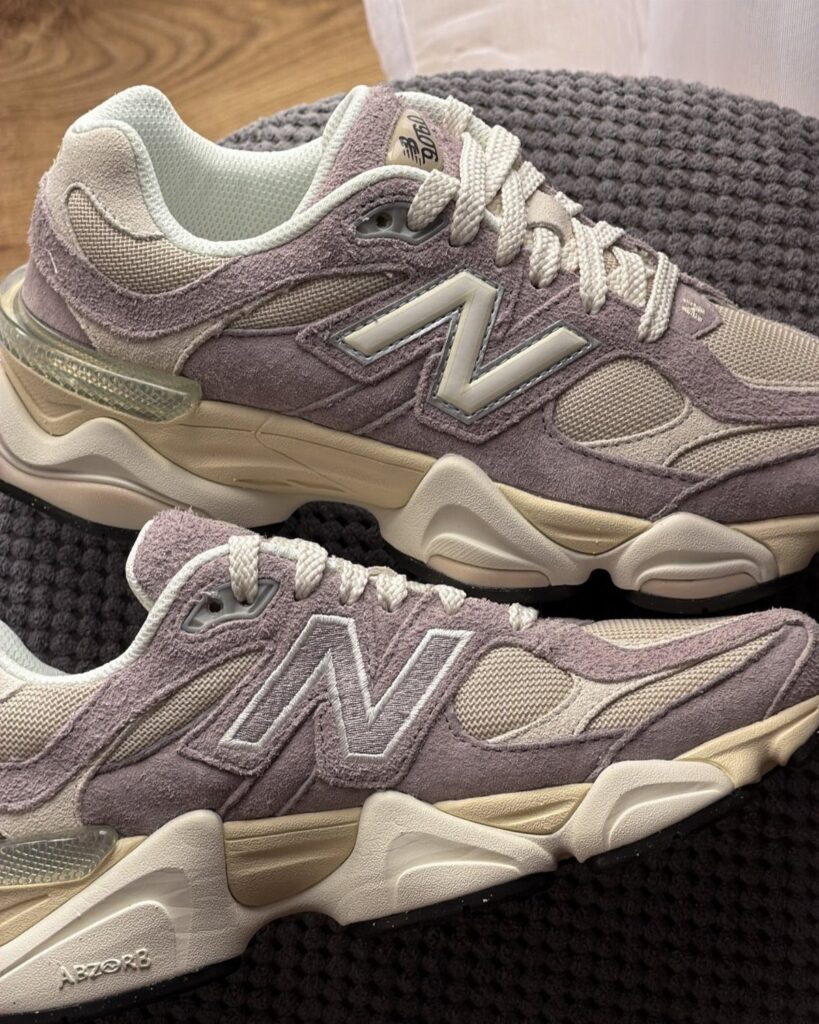 New Balance 9060 sneakers in truffle and purple on a grey textured background